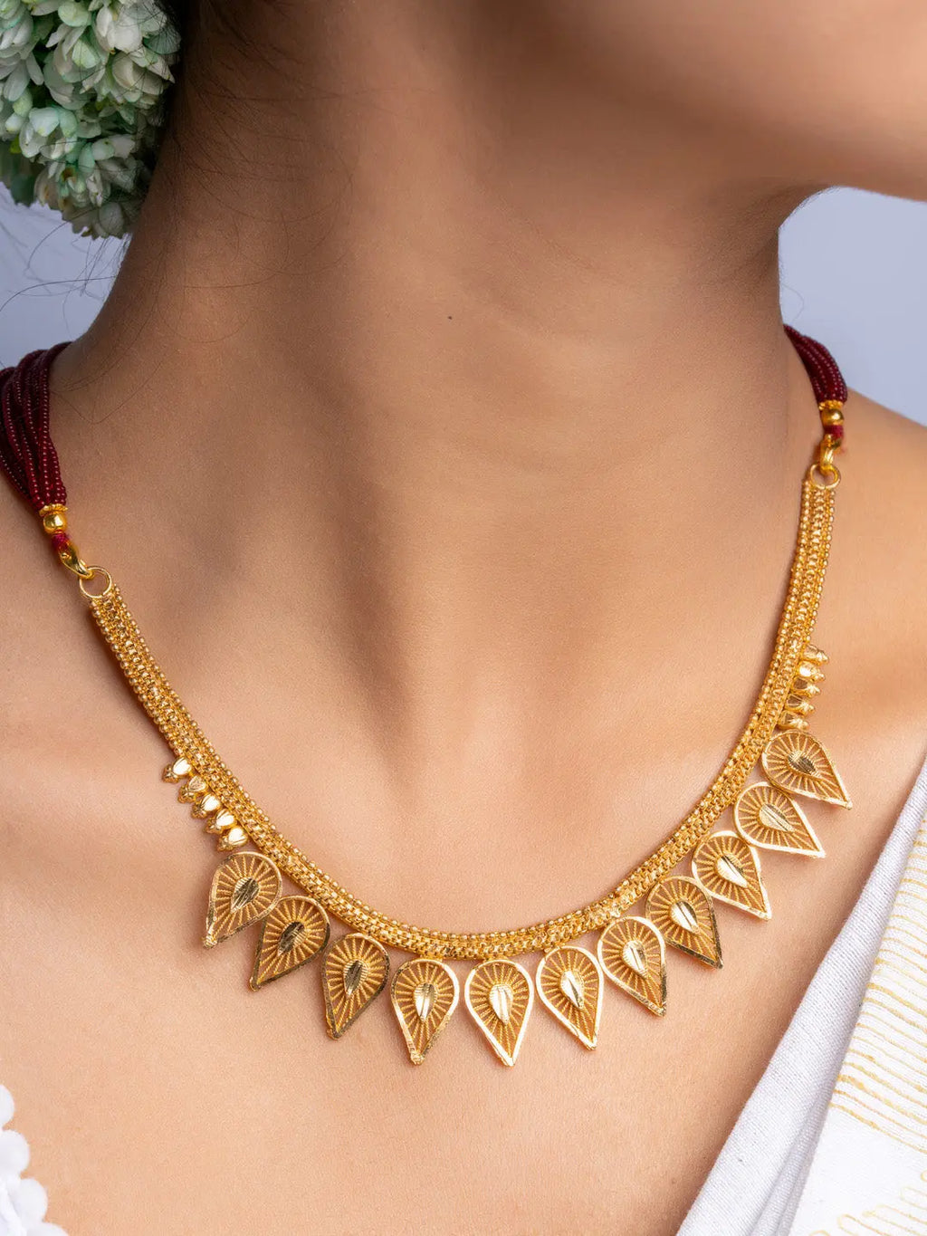 Elegant gold plated necklace set with intricate leaf-shaped pendants from LOOK AND ADORN