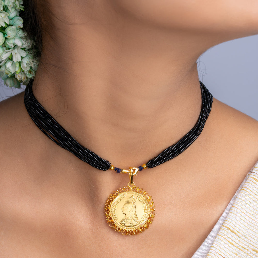 LOOK AND ADORN gold plated pendant with black beaded necklace worn on neck showcasing intricate design