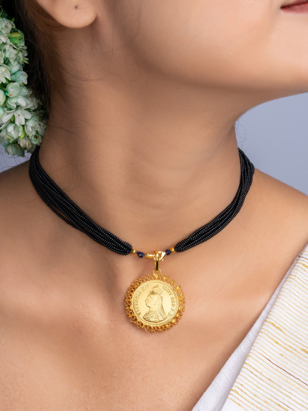 LOOK AND ADORN gold plated pendant with black beaded necklace worn on neck showcasing intricate design