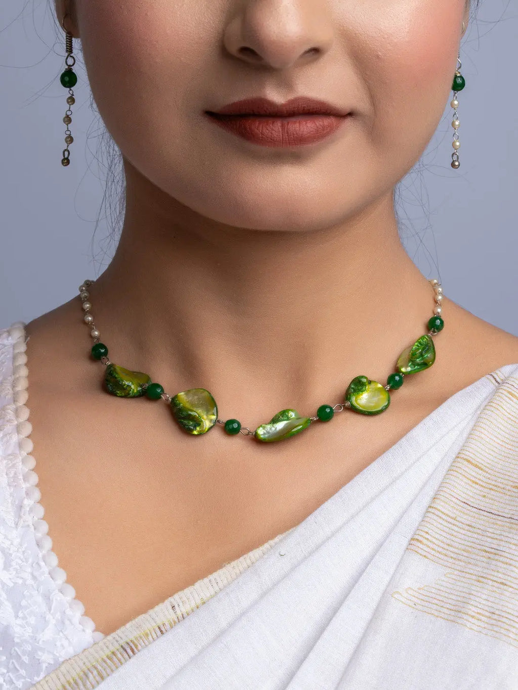 LOOK AND ADORN handmade mother of pearl necklace set with green and white beads worn by woman