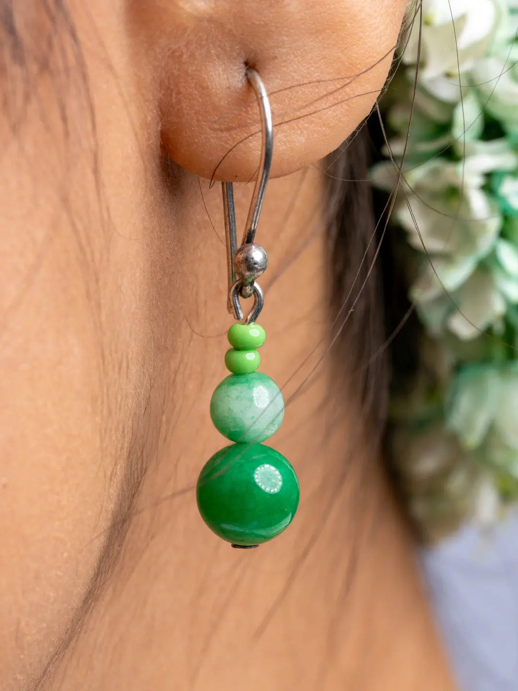 LOOK AND ADORN handmade green onyx necklace earrings with silver hooks close-up on ear