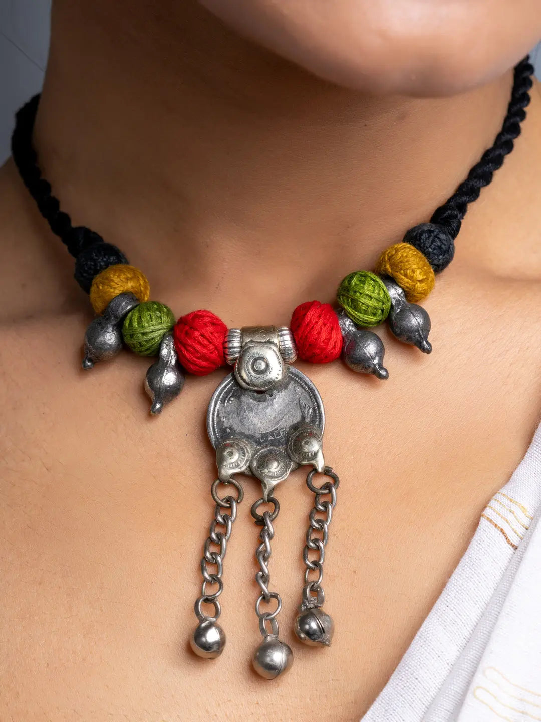 Afghani necklace set with colorful beads and silver pendant on black braided cord