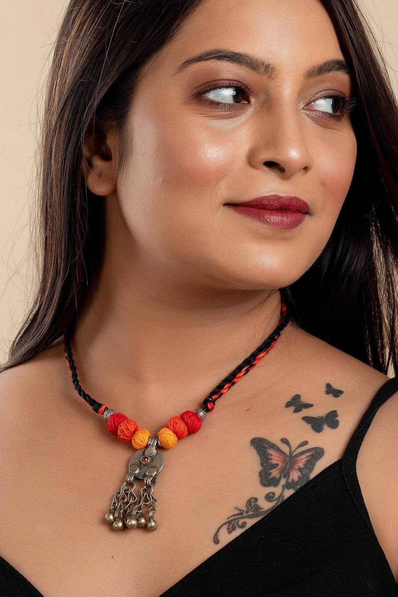Afghan Tibetan brass oxidised silver necklace with colorful beads worn by woman handmade jewelry