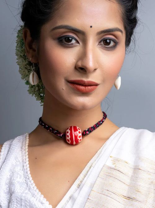 Handmade necklace set featuring a red bead pendant on black and red braided cord by LOOK AND ADORN
