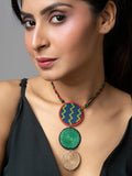 Handmade jute necklace with multicolor circular pendants worn by a woman in a black top