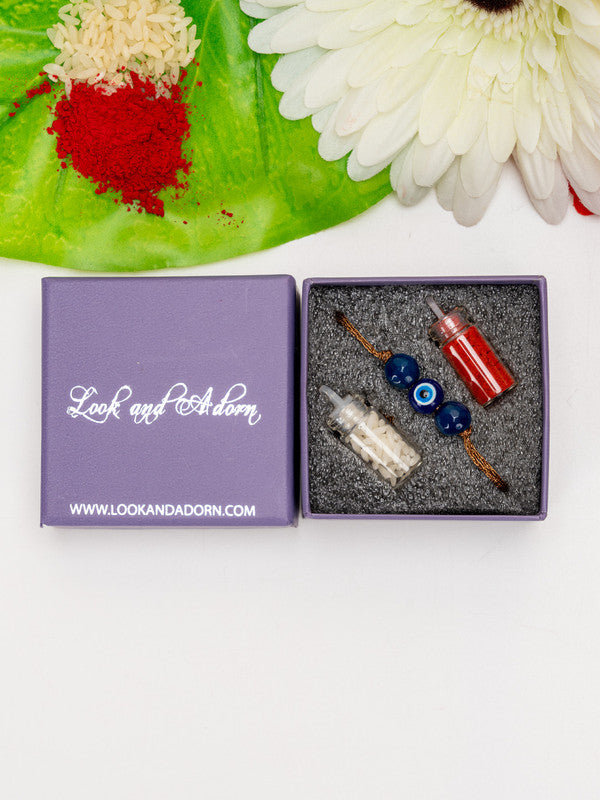 LOOK AND ADORN evil eye rakhi gift set with blue beads and small containers in purple box