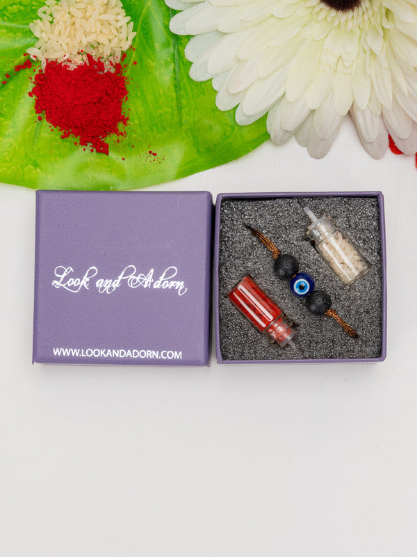Look and Adorn evil eye rakhi with black beads and red and white thread in purple gift box