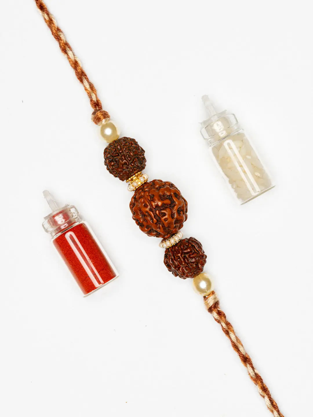 LOOK AND ADORN rudraksh rakhi with three brown rudraksh beads and a braided red thread