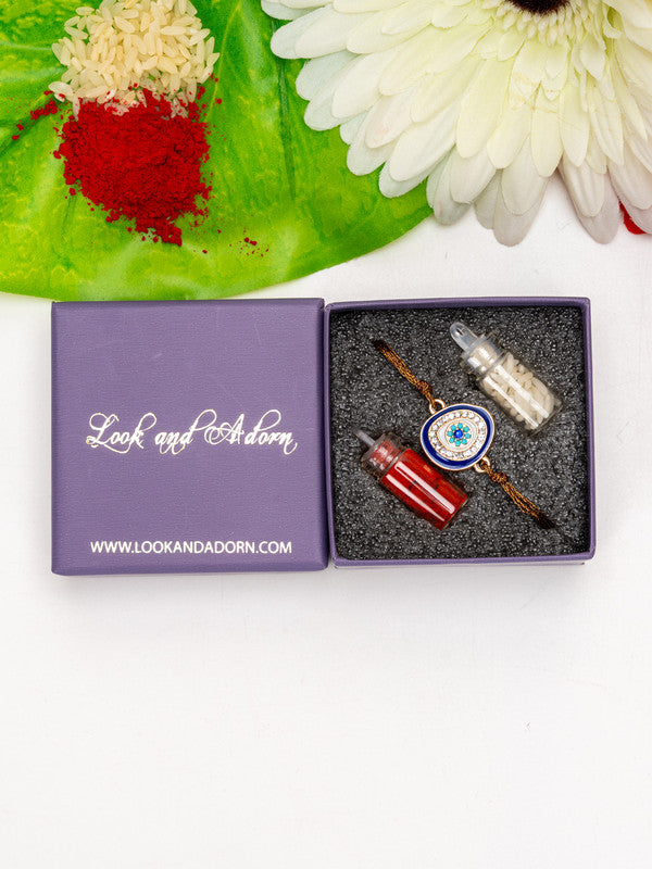 LOOK AND ADORN evil eye rakhi in gift box with red and white powder containers and white flower