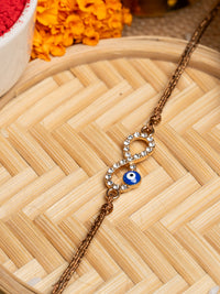 LOOK AND ADORN evil eye rakhi with crystal-studded infinity symbol and blue evil eye charm