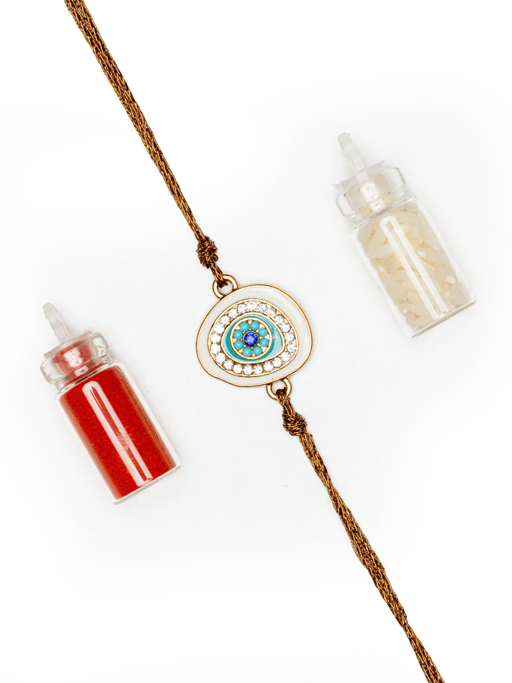 LOOK AND ADORN evil eye rakhi with blue and white stones on brown thread with red and white powder bottles