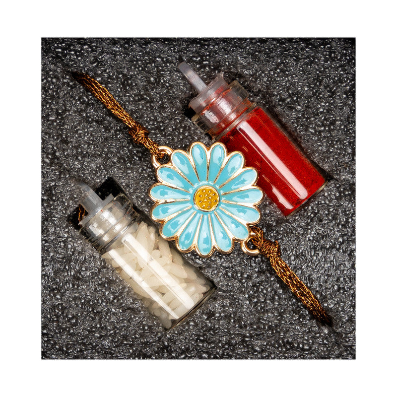 LOOK AND ADORN floral rakhi with blue flower design and two small containers of red and white powders