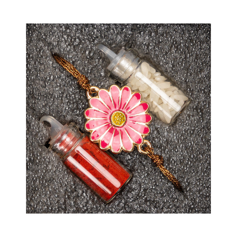 Floral rakhi with pink flower design and attached red and white traditional containers