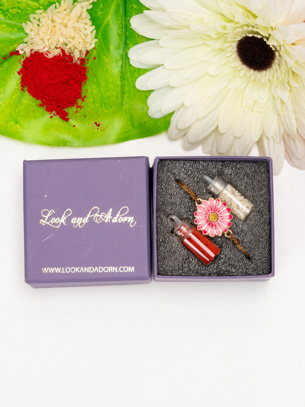 LOOK AND ADORN floral rakhi with pink flower design and red and white spices in purple gift box