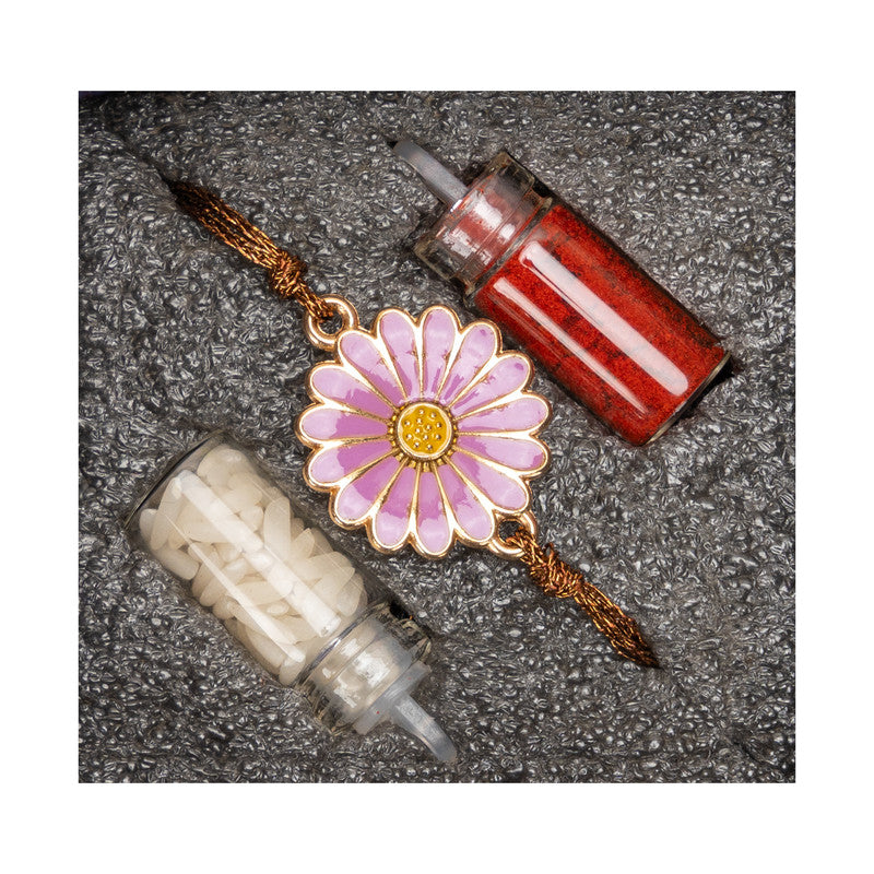 LOOK AND ADORN floral rakhi with pink and yellow flower design alongside red and white ritual powders