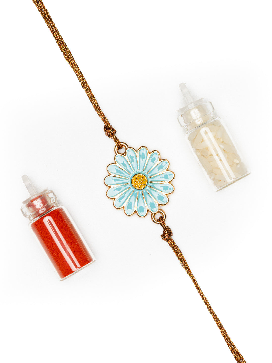 LOOK AND ADORN floral rakhi with blue and white flower design and thread, accompanied by red and white powder containers