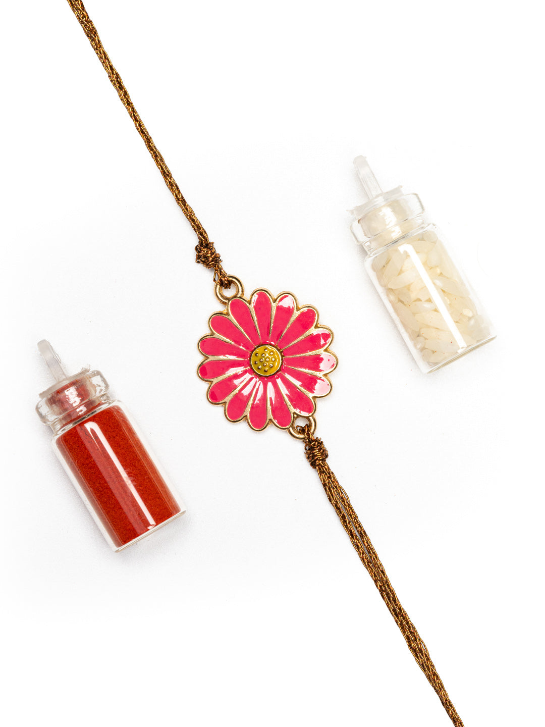 LOOK AND ADORN floral rakhi with pink flower charm and brown thread alongside red and white powder bottles