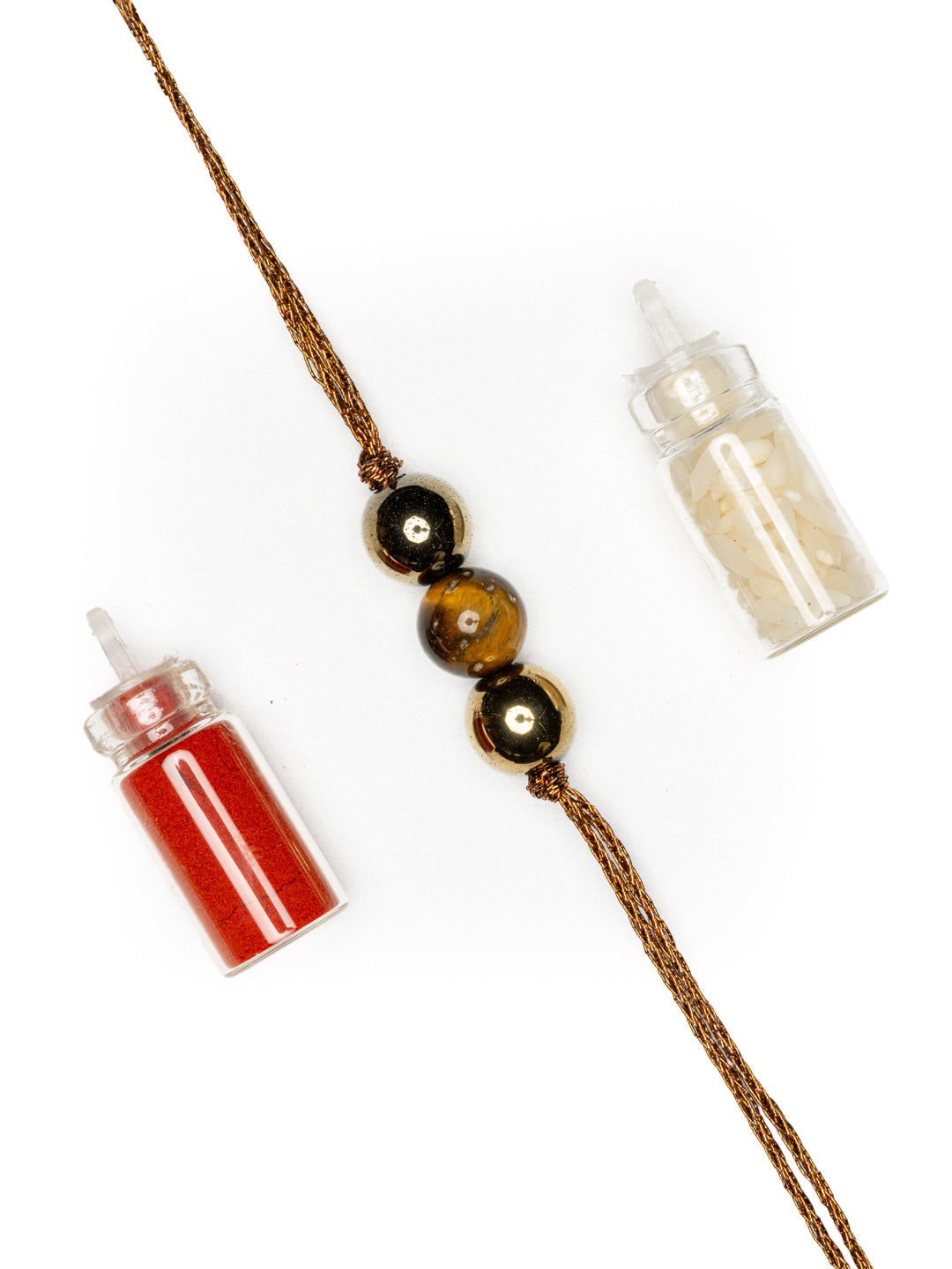 LOOK AND ADORN tiger eye rakhi with three beads and brown thread alongside red and white powder containers