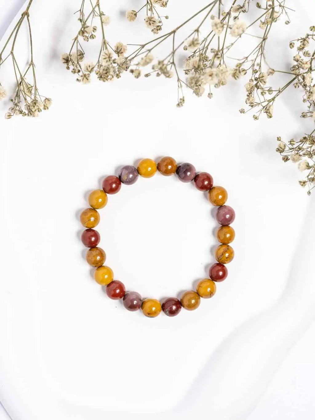 Mookaite Jasper Bracelet featuring vibrant yellow, red, and purple hues in a stylish stretchy design