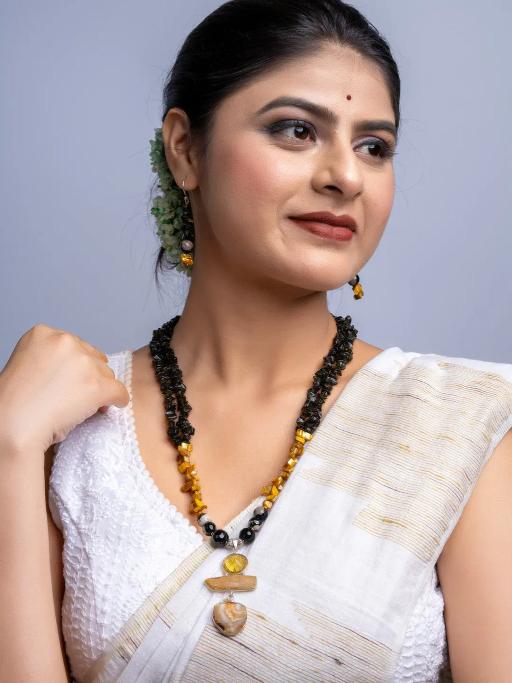 Elegant Mother of Pearl Necklace Set worn by woman with traditional white saree and gold accents