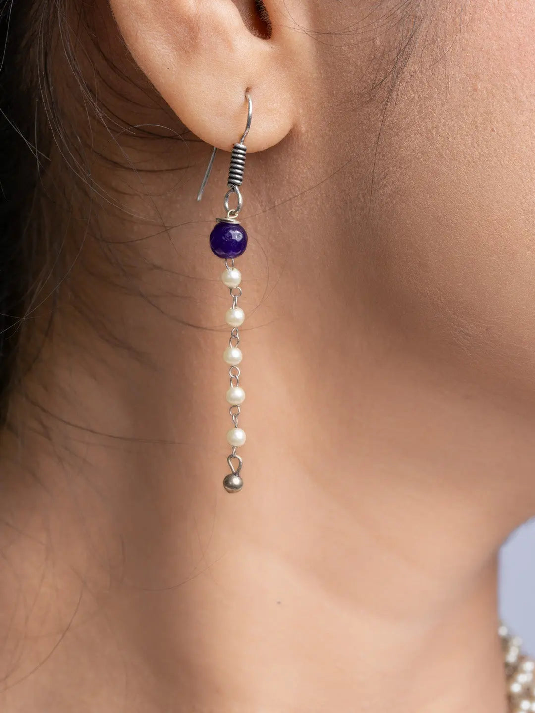 Handmade mother of pearl necklace set featuring delicate pearl and purple bead earrings
