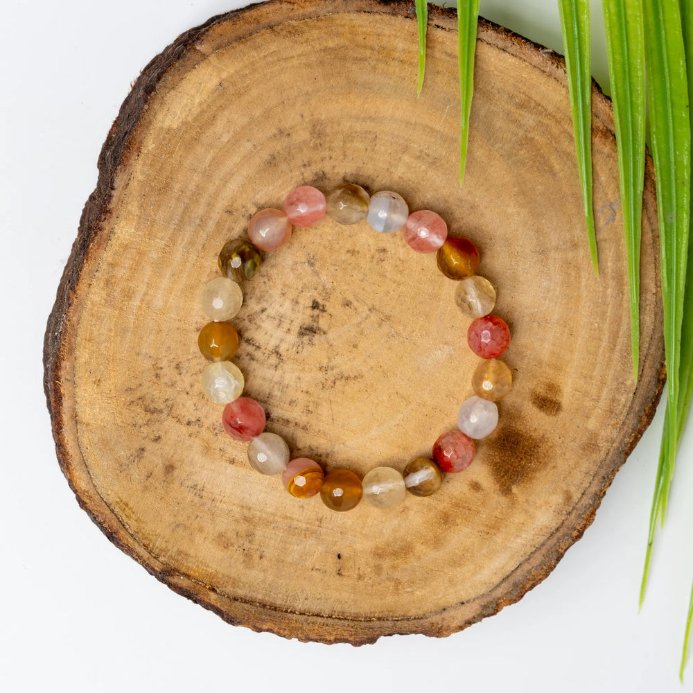Multi Cherry Quartz Bracelet on a wooden surface with natural texture for stylish adornment