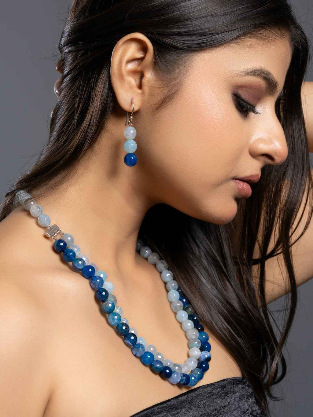 Handmade onyx necklace set featuring various shades of blue and gray gemstones for a unique look