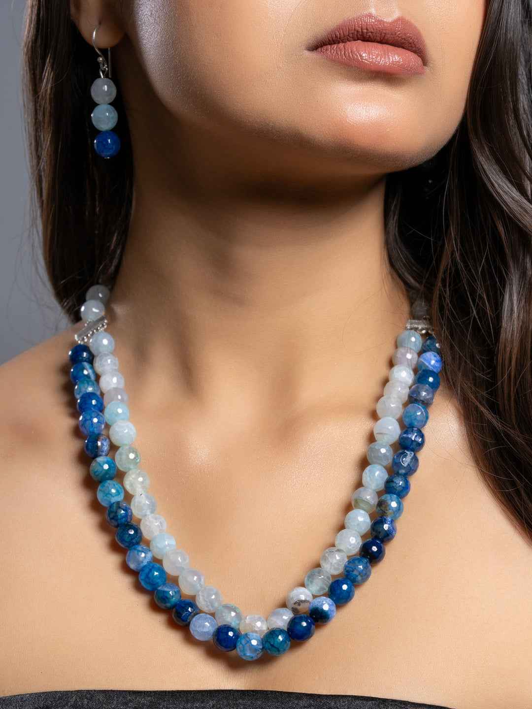 Handmade onyx necklace set in blue and grey hues featuring layered gemstone design
