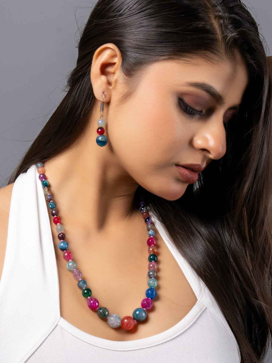 Colorful handmade onyx necklace set featuring vibrant beads in shades of red, blue, and green