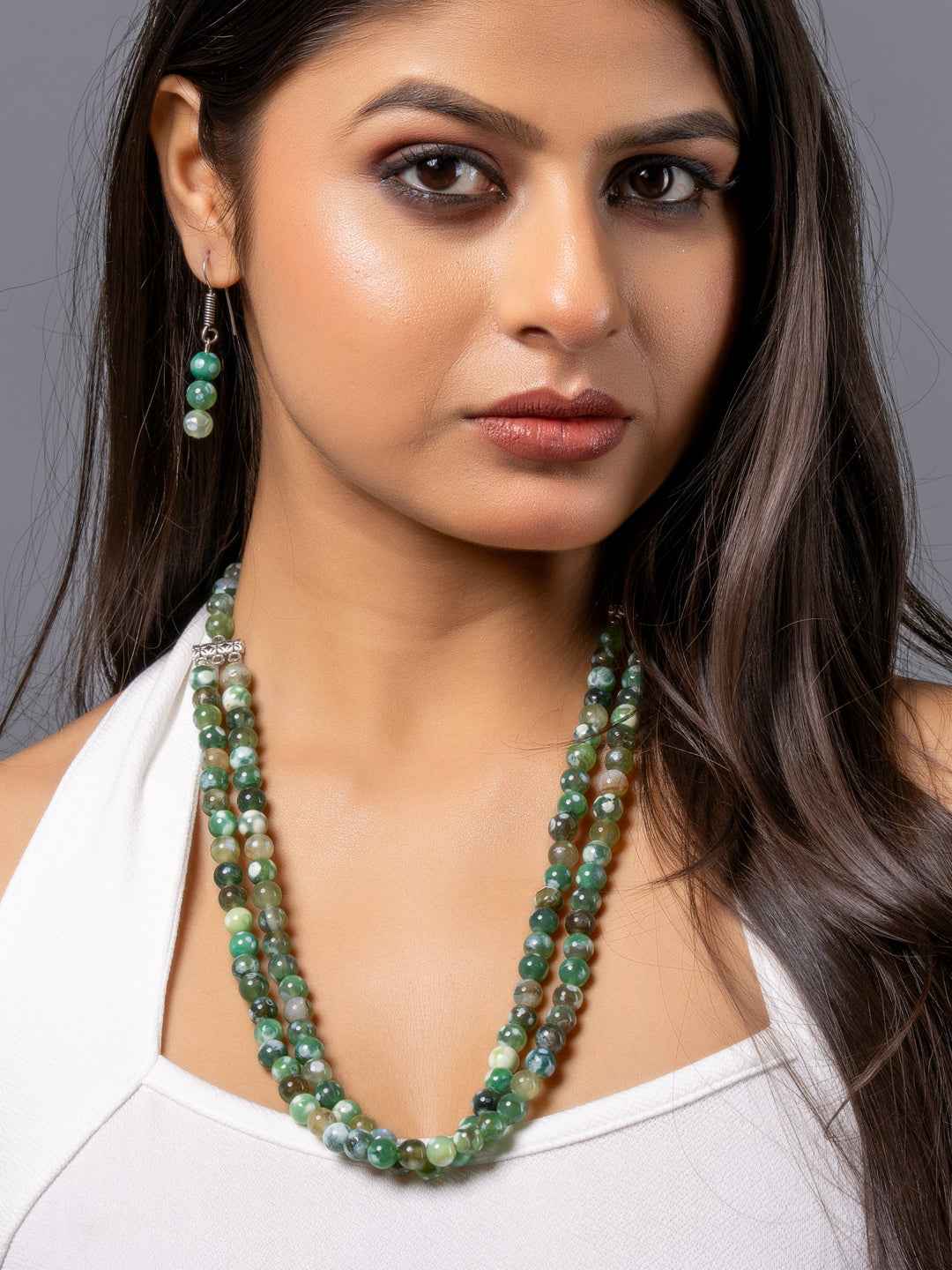 Multi-strand green onyx necklace set with matching earrings, handcrafted for unique elegance