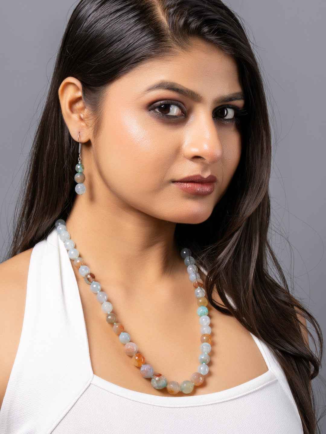Handmade onyx necklace set in multi-colored beads worn by a model, showcasing elegant style and craftsmanship