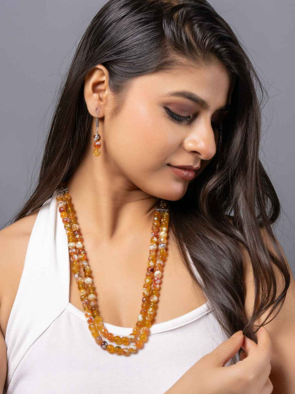 Handmade onyx necklace set with colorful beads and matching earrings, perfect for elegant occasions