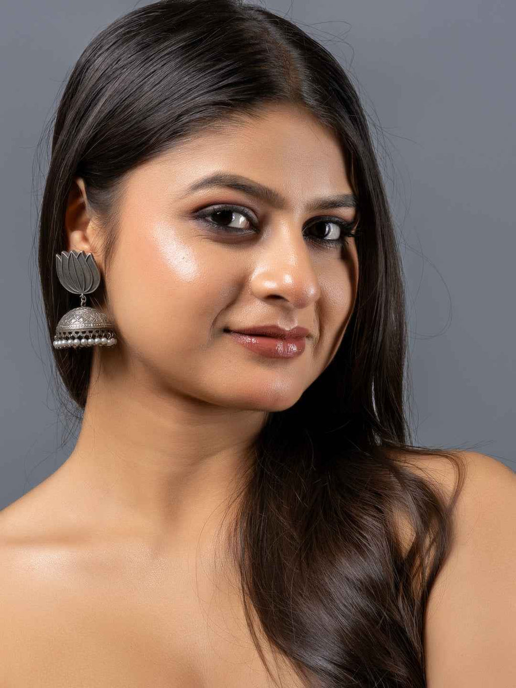 Oxidised earrings in silver with elegant lotus design and traditional style perfect for ethnic wear
