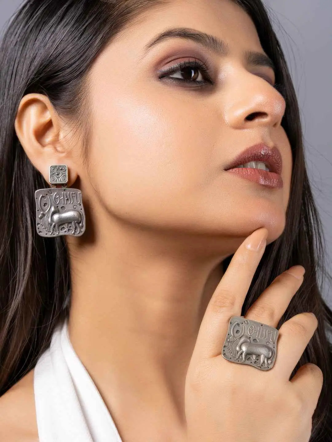 Oxidised earrings with intricate elephant design and matching ring, showcasing a vintage silver finish