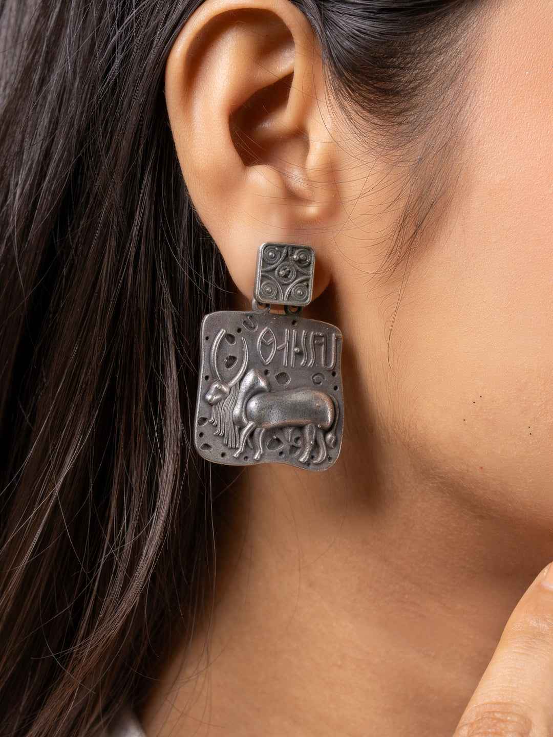 Oxidised earrings featuring intricate animal motifs with a vintage-inspired design in dark grey metal