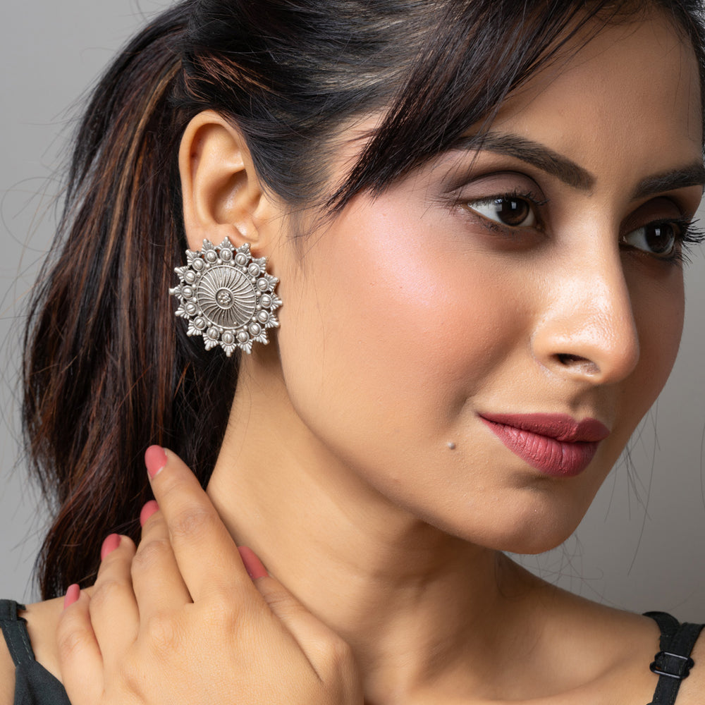 LOOK AND ADORN oxidised earrings in oxidised silver worn by woman with a black top