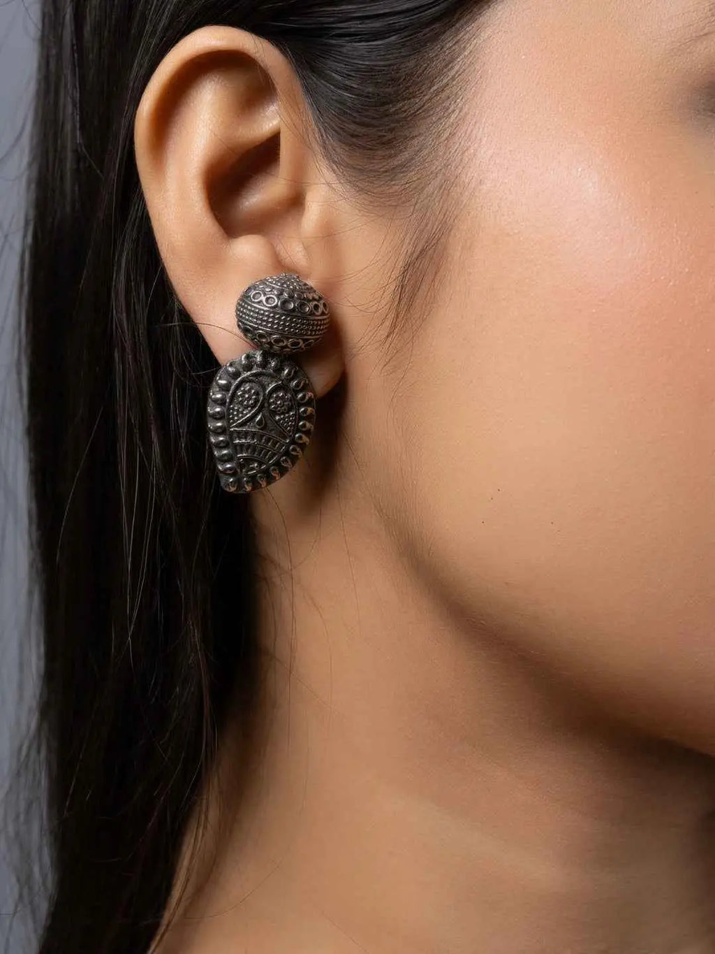Oxidised earrings featuring intricate leaf designs in dark silver tone for a stylish vintage look