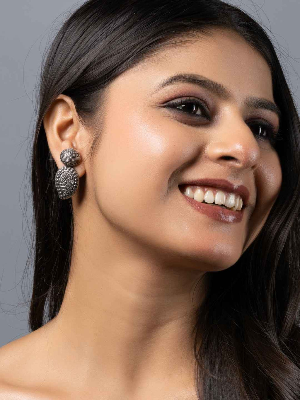 Oxidised earrings in intricate floral design with silver-tone for elegant style