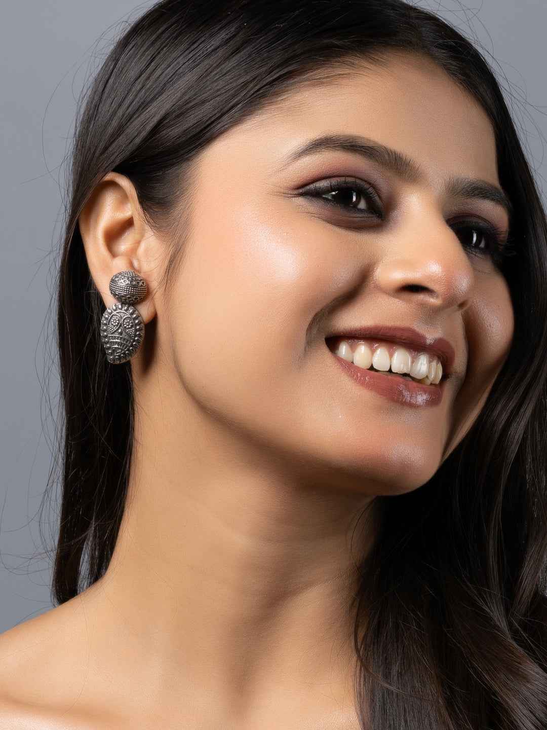 Oxidised earrings in intricate floral design with silver-tone for elegant style