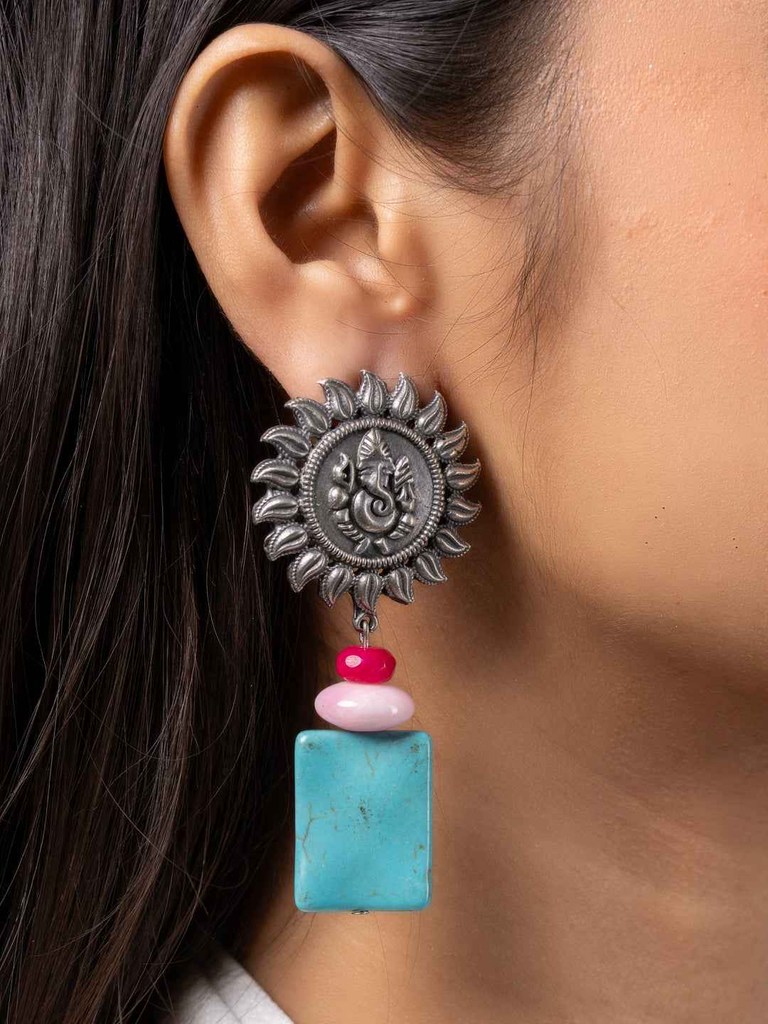 Oxidised earrings featuring a sun design with turquoise and pink beads for a stylish, handmade look