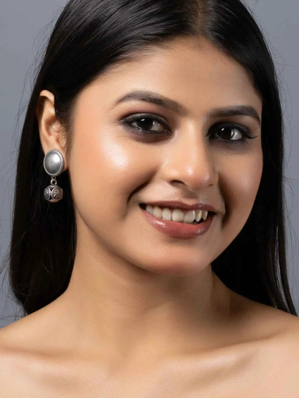 Oxidised earrings featuring silver-toned circular design with intricate detailing for a stylish look
