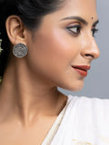 Close-up of a woman wearing oxidised silver earrings with traditional design from LOOK AND ADORN