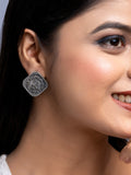 LOOK AND ADORN oxidised silver earrings worn by woman featuring intricate coin design