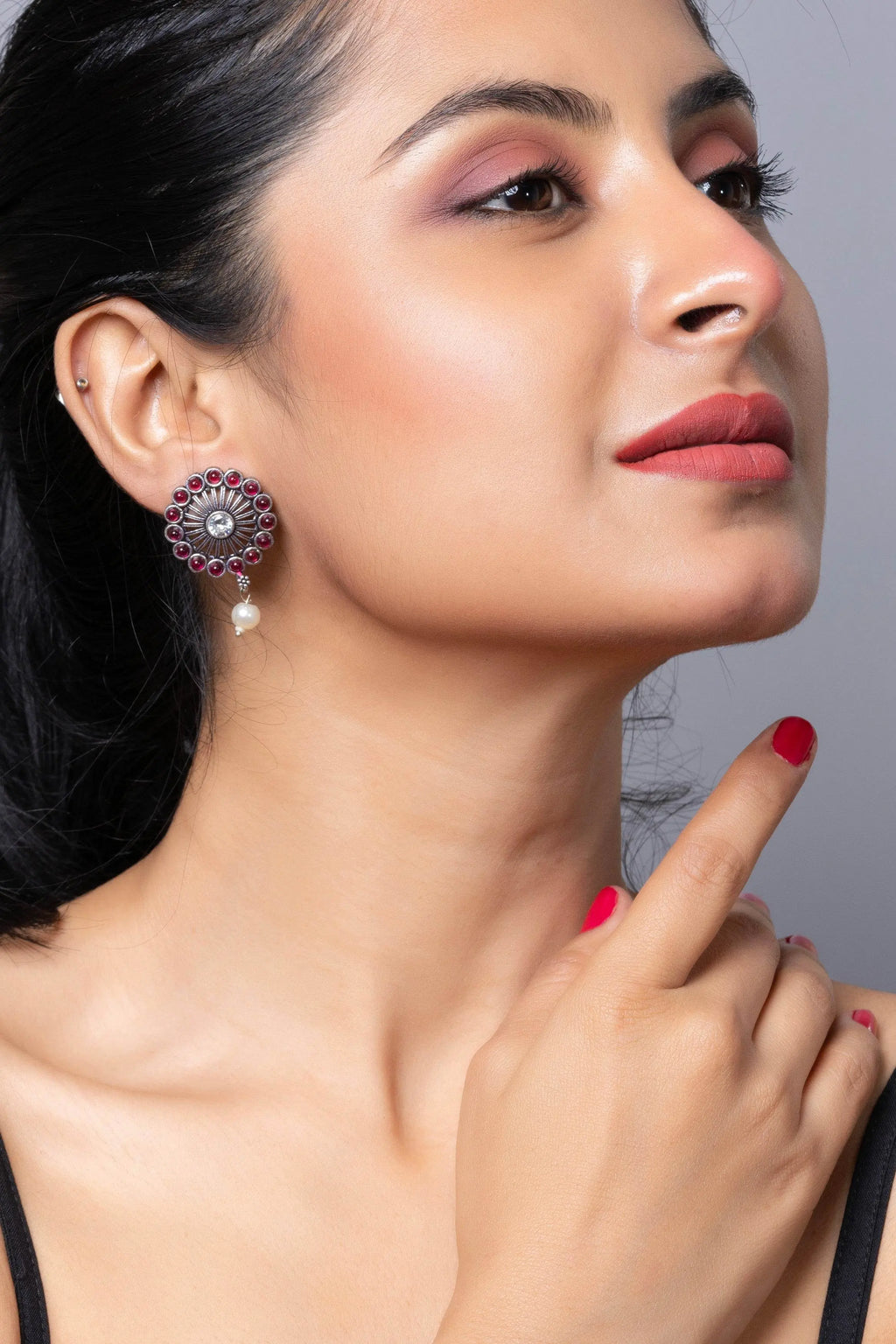 Elegant oxidised silver stud earring with intricate design and pearl accent for a stylish look