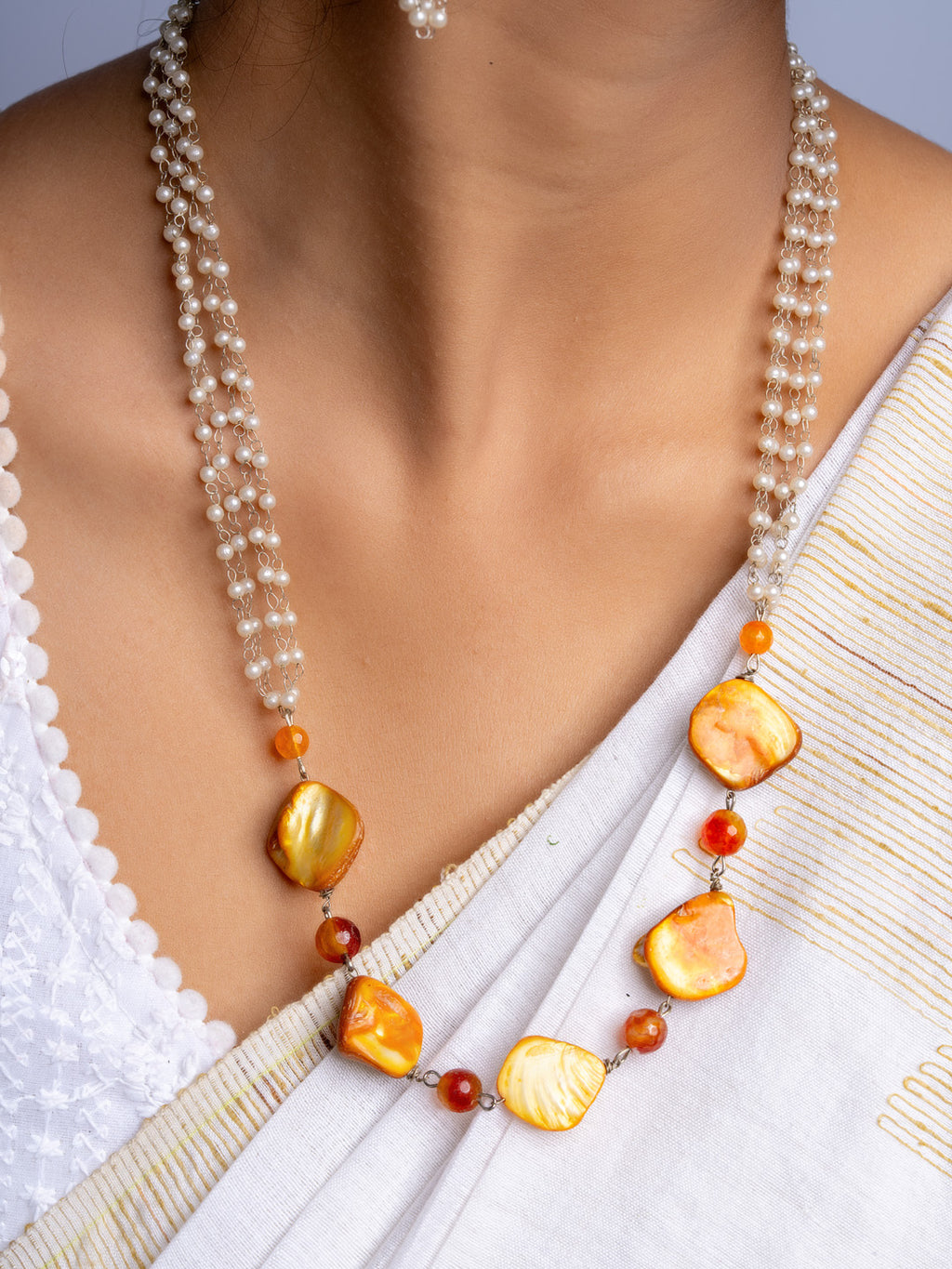Handmade mother of pearl necklace set with pearl strands and golden shell accents by LOOK AND ADORN