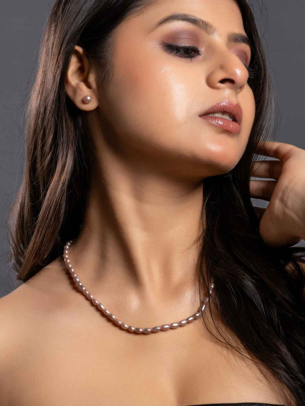 Elegant handmade pearl necklace set featuring lustrous pink pearls, perfect for any occasion.