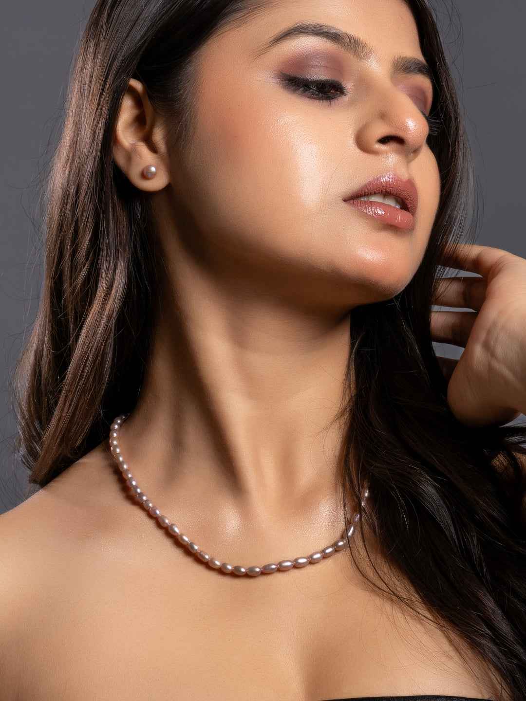 Elegant handmade pearl necklace set featuring lustrous pink pearls, perfect for any occasion.