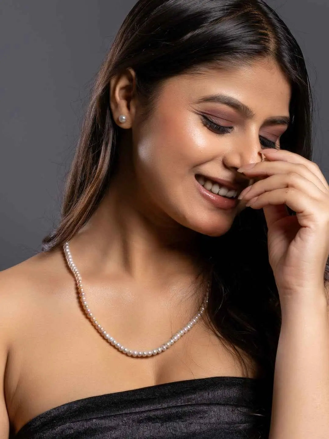 Elegant handmade pearl necklace set in creamy white, paired with matching pearl stud earrings