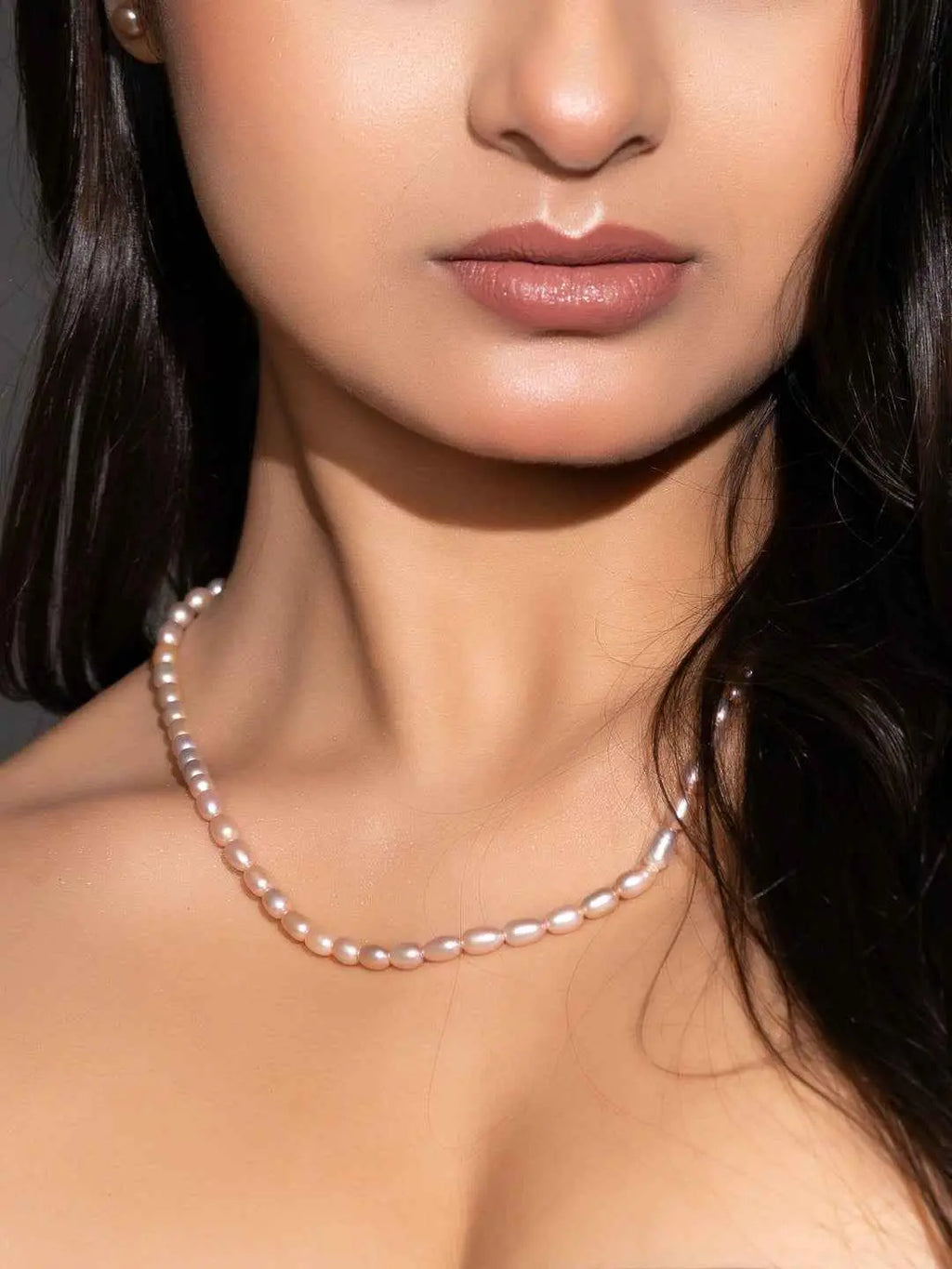 Handmade pearl necklace set featuring lustrous pink pearls in a classic design