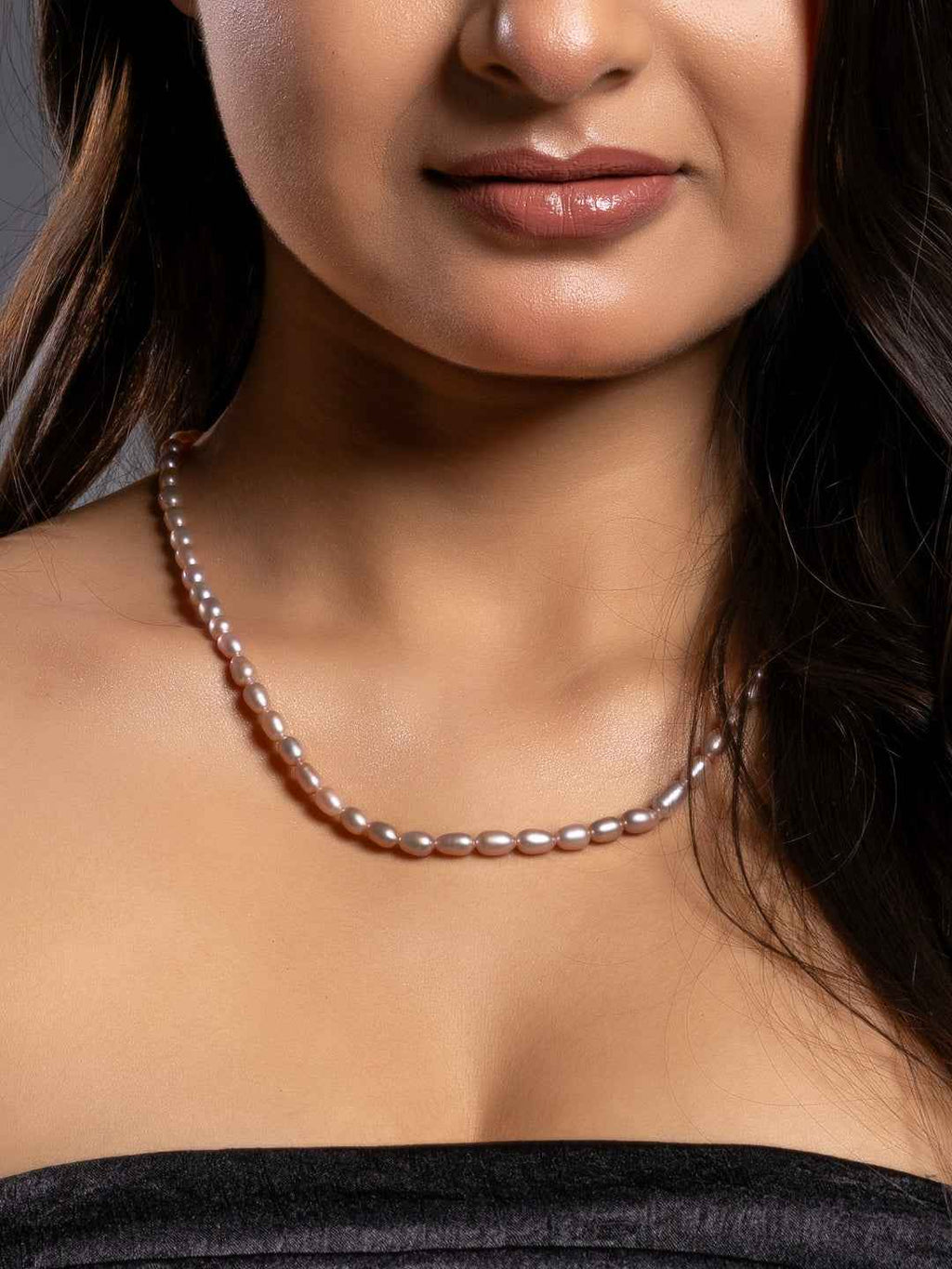 Handmade pearl necklace set in soft pink tones, featuring elegant uniform pearls for a classic look